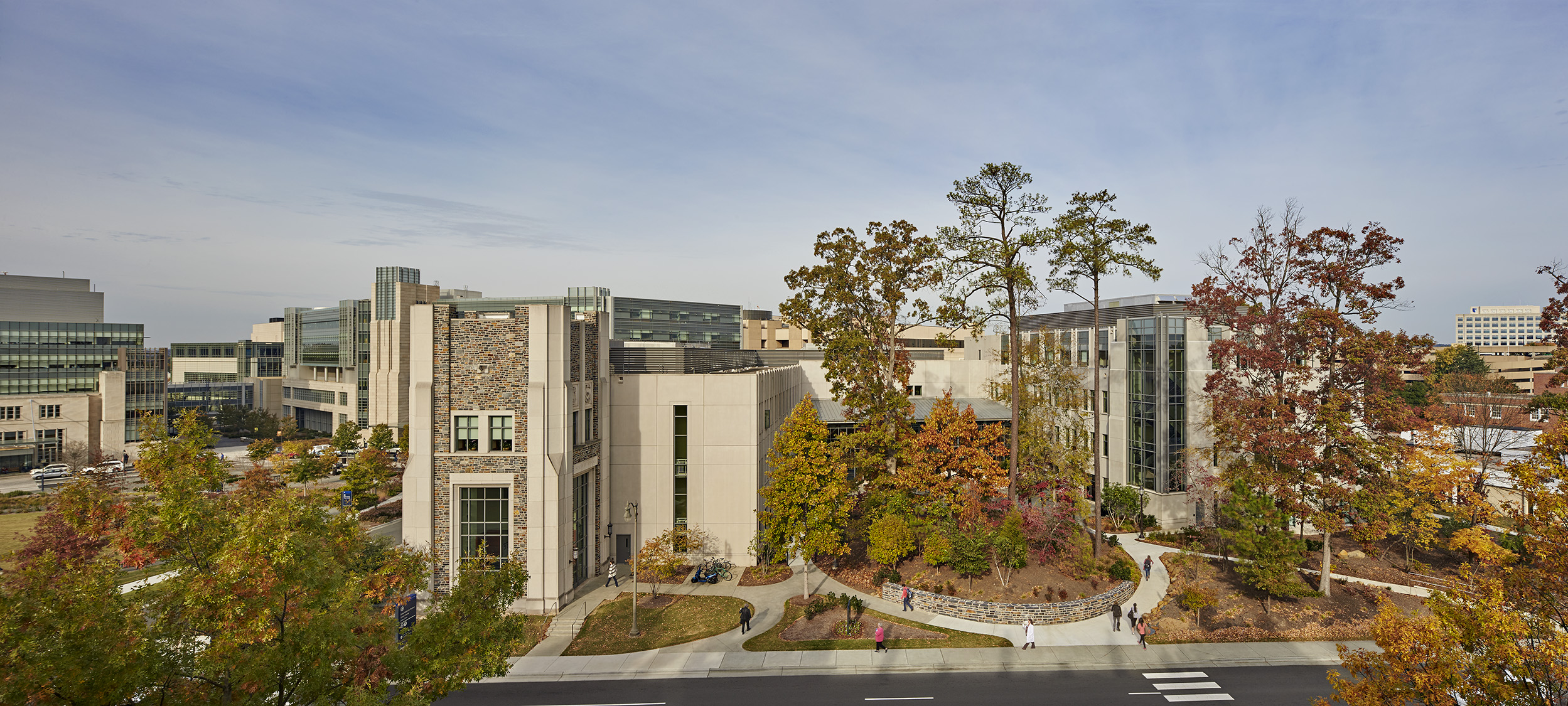 Exterior view of the Pearson Building surrounding a landscaped courtyard with trees and walkways.